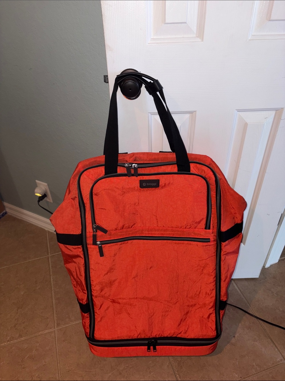 Biaggi ZipSak 31”foldable spinner Rolling Duffle Bag Luggage in orange